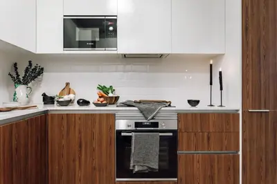 a kitchen with white cabinets and a stove top oven at Algar - 1 bedroom and balcony in Eixample Esquerra in Barcelona