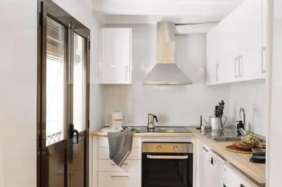 a living room with a couch and a dining room at Acatenango - 2 bedrooms in El Born in Barcelona
