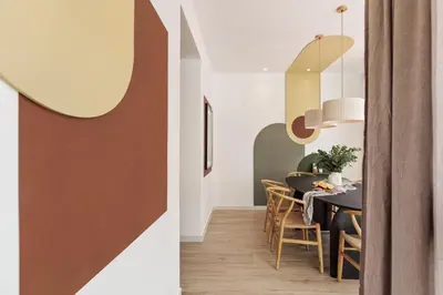 a bedroom with a bed with a green headboard at Sishane - 3 bedrooms and terrace in Eixample Esquerra in Barcelona