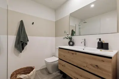 a living room with a couch and a table at Nal - 2 bedrooms, office and balcony in Eixample Dreta in Barcelona