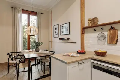 a dining room with a table and chairs at Kusku - 3 bedrooms and balcony in Eixample Dreta in Barcelona