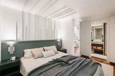 a bedroom with a large bed with a wooden ceiling at Agerola - 2 bedrooms in Eixample Dreta in Barcelona