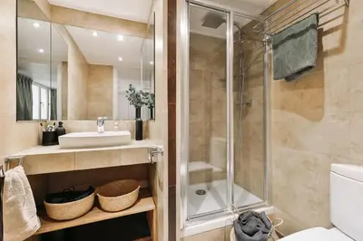 a bedroom with a large bed with a green headboard at Agerola - 2 bedrooms in Eixample Dreta in Barcelona