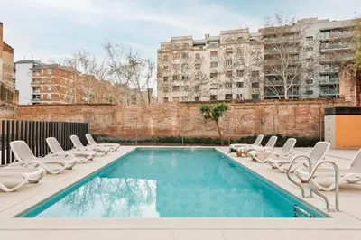 a playground with a slide and a slideintend at Aliga - 3 bedroom and pool in Les Corts in Barcelona