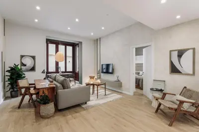 a living room with a couch and a mirror at Cliento - 2 bedrooms and terrace in Ciutat Vella in Barcelona