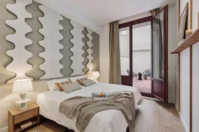 a living room with a couch and a table at Cliento - 2 bedrooms and terrace in Ciutat Vella in Barcelona