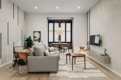 a living room with a couch and a table at Cliento - 2 bedrooms and terrace in Ciutat Vella in Barcelona