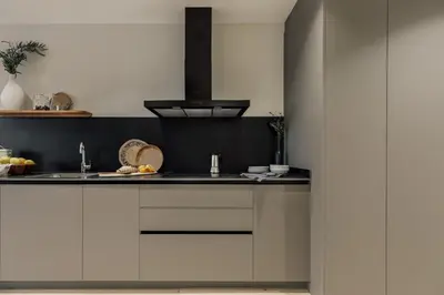 a kitchen with a sink and a living room at Deisis - 2 bedrooms and balcony in Sant Pere in Barcelona