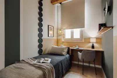a bedroom with a bed and two windows at Deisis - 2 bedrooms and balcony in Sant Pere in Barcelona