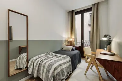 a living room with a couch and a table at Pogerola - 2 bedrooms, balcony and terrace in Ciutat Vella in Barcelona