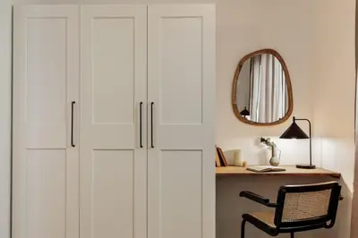 a living room with a blue and white kitchen at Tamar - 2 bedrooms and terrace in Sant Gervasi in Barcelona