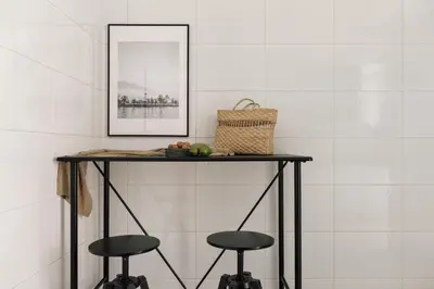 a living room with a table and a tv at Edera - 3 bedrooms and balcony in Eixample Dreta in Barcelona