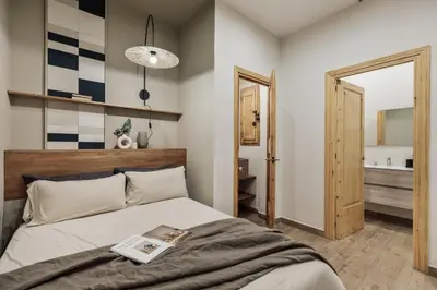a living room with a couch and a table at Ada - 2 bedrooms and balcony in Eixample Dreta in Barcelona