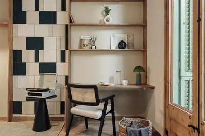 a living room with a couch and a table at Ada - 2 bedrooms and balcony in Eixample Dreta in Barcelona