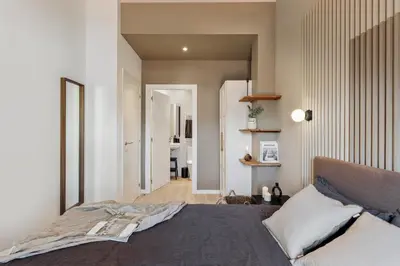 a bedroom with a bed and a table with a night stand at Albera - 2 bedrooms in Sant Antoni in Barcelona