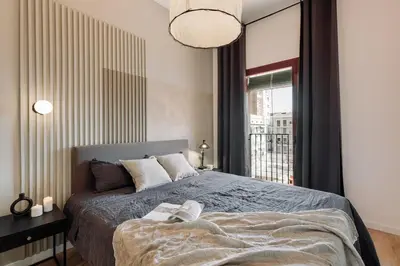 a dining room and living room with a table and chairs at Albera - 2 bedrooms in Sant Antoni in Barcelona