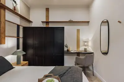 a living room with a tv and a couch at Kayra - 2 bedrooms and terrace in La Sagrada Familia in Barcelona
