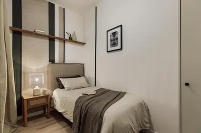 a bedroom with a bed with a tray of food on it at Kayra - 2 bedrooms and terrace in La Sagrada Familia in Barcelona