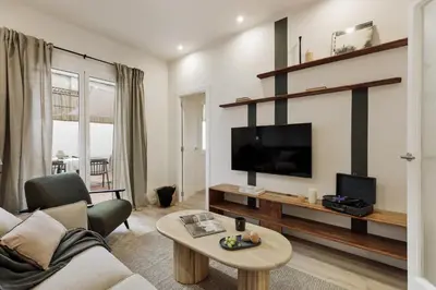 a bedroom with a bed with a tray of food on it at Kayra - 2 bedrooms and terrace in La Sagrada Familia in Barcelona