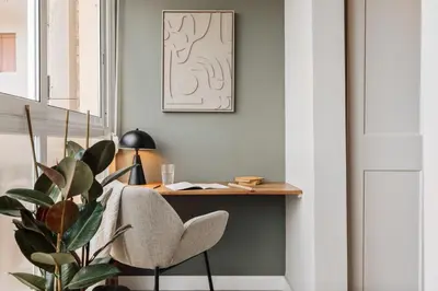a small kitchen with a table and chairs in a room at Freso - Studio in Eixample Esquerra in Barcelona