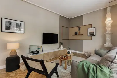a bathroom with a toilet and a sink and a mirror at Cahuita - 2 bedrooms and office in Sants in Barcelona
