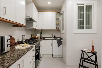 a living room with a dining room table and chairs at Cahuita - 2 bedrooms and office in Sants in Barcelona