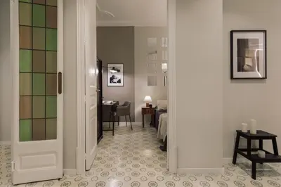 a living room with a couch and a table at Cumulus - 2 bedrooms and balcony in Vila de Gràcia in Barcelona