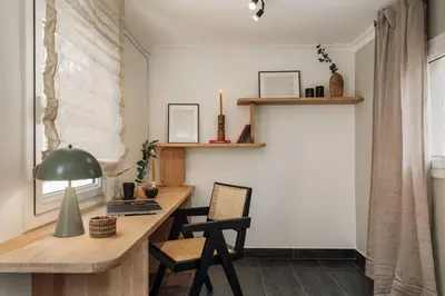 a living room with a couch and a tv at Baru - 2 bedrooms and terrace in Eixample Esquerra in Barcelona