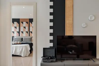 a living room with a couch and a table at Kabatas - 3 bedrooms and patio in Eixample Dreta in Barcelona