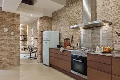 a living room with a couch and a table at Galata - 3 bedrooms and terrace in Vila de Gràcia in Barcelona