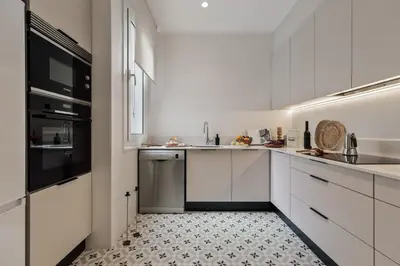 a dining room with a table and chairs at Davut - 3 bedrooms and office in Eixample Esquerra in Barcelona