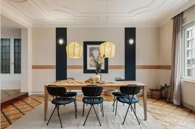 a living room with a couch and a table at Sark - 3 bedrooms and balcony in Sant Gervasi in Barcelona