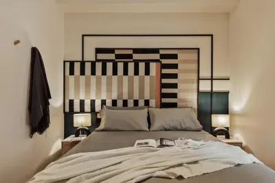 a bedroom with a bed and two windows at Sark - 3 bedrooms and balcony in Sant Gervasi in Barcelona