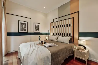a bedroom with a large bed with two lamps at Sark - 3 bedrooms and balcony in Sant Gervasi in Barcelona