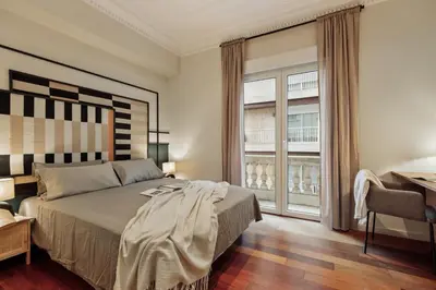a bedroom with a large bed in a room at Sark - 3 bedrooms and balcony in Sant Gervasi in Barcelona