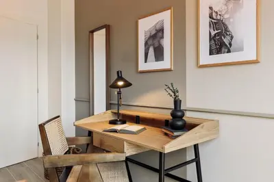 a bedroom with a bed and a desk and a bed and a table at Fageda - 2 bedrooms and balcony in Sant Antoni in Barcelona