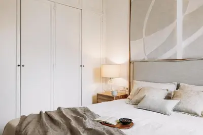 a bedroom with a large bed and a large window at Tramonto - 3 bedrooms and balcony in Sant Antoni in Barcelona