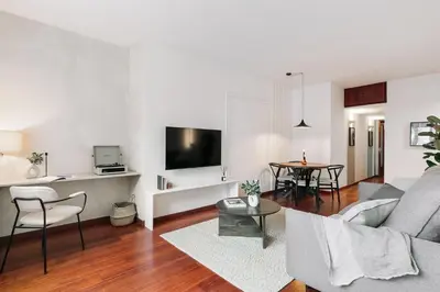 a living room with a couch and a table at Tramonto - 3 bedrooms and balcony in Sant Antoni in Barcelona