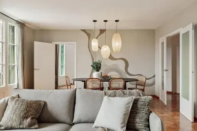 a living room with a couch and a tv at Nicoya - 3 bedrooms and balcony in Eixample Dreta in Barcelona