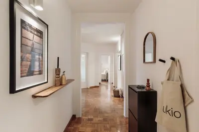 a bedroom with a bed and two windows at Nicoya - 3 bedrooms and balcony in Eixample Dreta in Barcelona