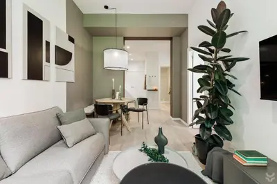 a living room with a couch and a table at Roses - 1 bedroom and balcony in Sant Antoni in Barcelona