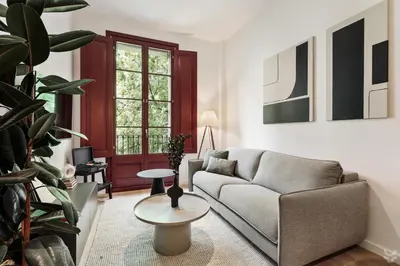 a kitchen with white cabinets and black counter tops at Roses - 1 bedroom and balcony in Sant Antoni in Barcelona