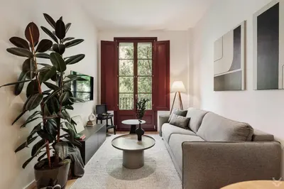 a bedroom with a bed and a mirror and a desk at Roses - 1 bedroom and balcony in Sant Antoni in Barcelona