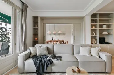 a living room with a couch and a table at Rama - 3 bedrooms and terrace in Sant Gervasi in Barcelona