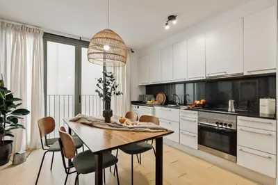 a living room with a couch and a tv at Mercan - 2 bedrooms in Sant Pere in Barcelona