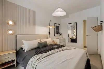 a room with a desk and a large black cabinet at Caliph - 2 bedrooms and office in El Putxet i el Farró in Barcelona