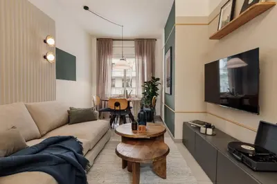 a white kitchen with white cabinets and a sink at Caliph - 2 bedrooms and office in El Putxet i el Farró in Barcelona