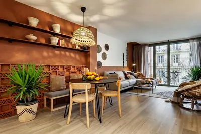 a living room with a couch and a tv at Kufra - 3 bedrooms in Eixample Esquerra in Barcelona