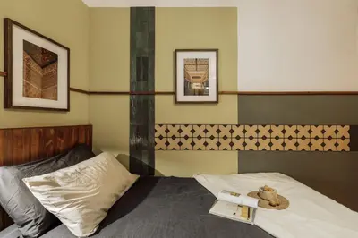 a bedroom with a bed with two books on it at Peri - 2 bedrooms in Sant Pere in Barcelona