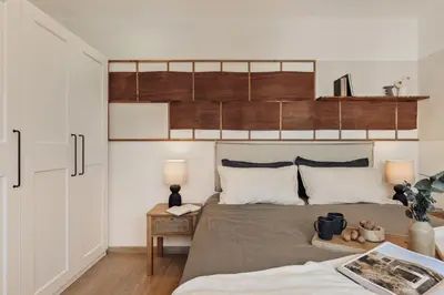 a living room with a bed and a television at Isora - 1 bedroom in El Gòtic in Barcelona